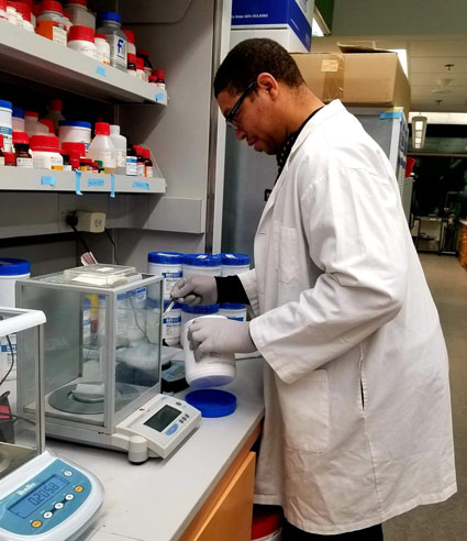 A.J. Hinton conducts research in his lab.