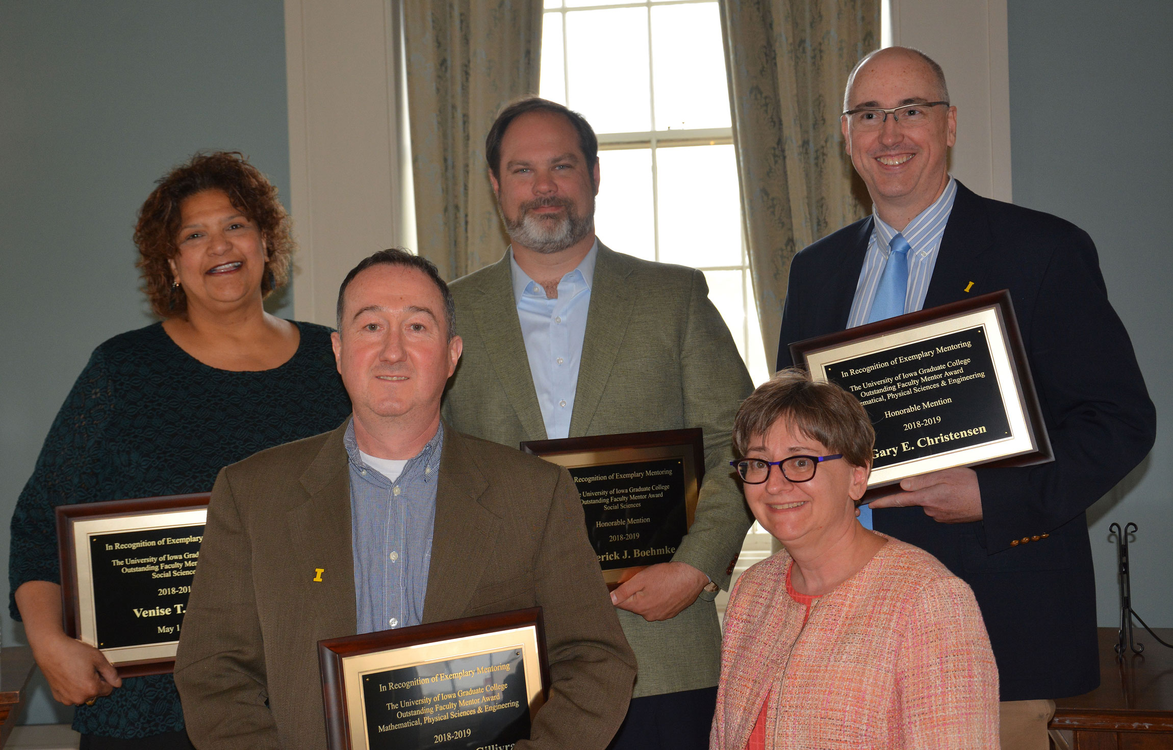 Graduate College Associate Dean Shelly Campo with winners of the 2018-19 Outstanding Faculty Mentor Award.