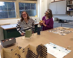 Teresa Mangum works with Ruth Bryant, an MFA student in the Center for the Book, during the Obermann Graduate Institute.