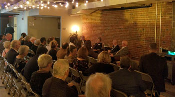 The crowd listens to insights about graduate education at the UI.