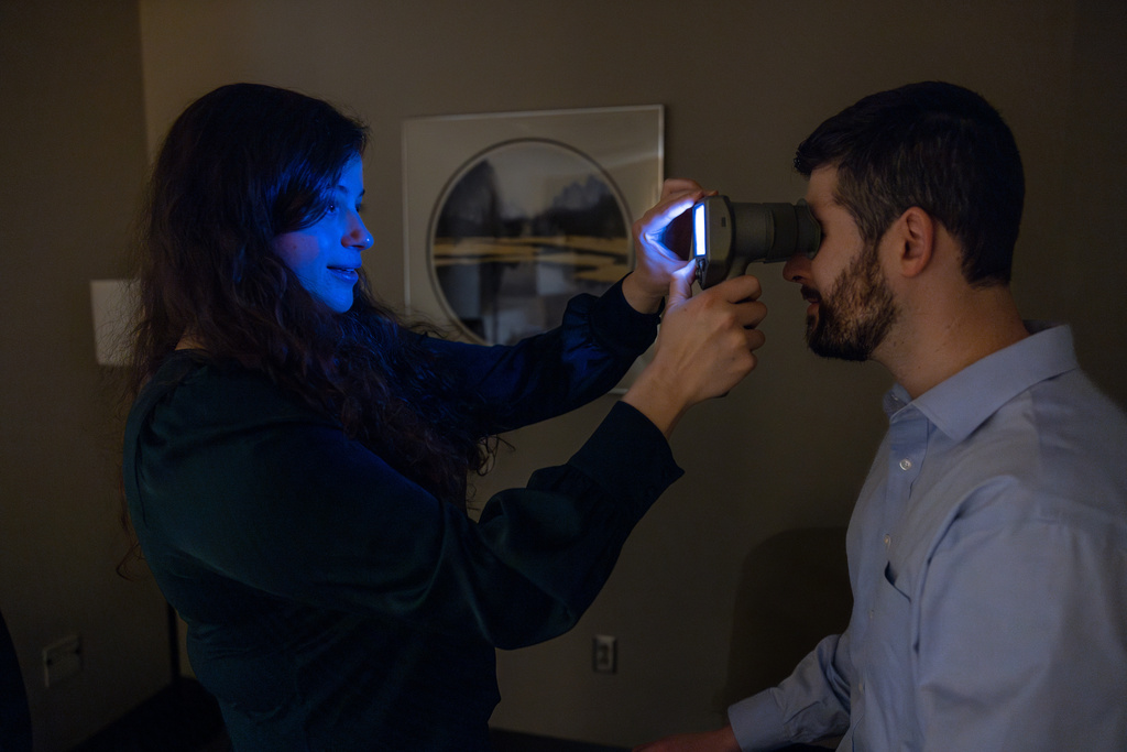 Maddie Mocchi demonstrates her research technique.