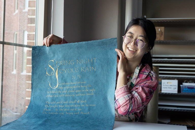 Clara Ng shows a calligraphy project