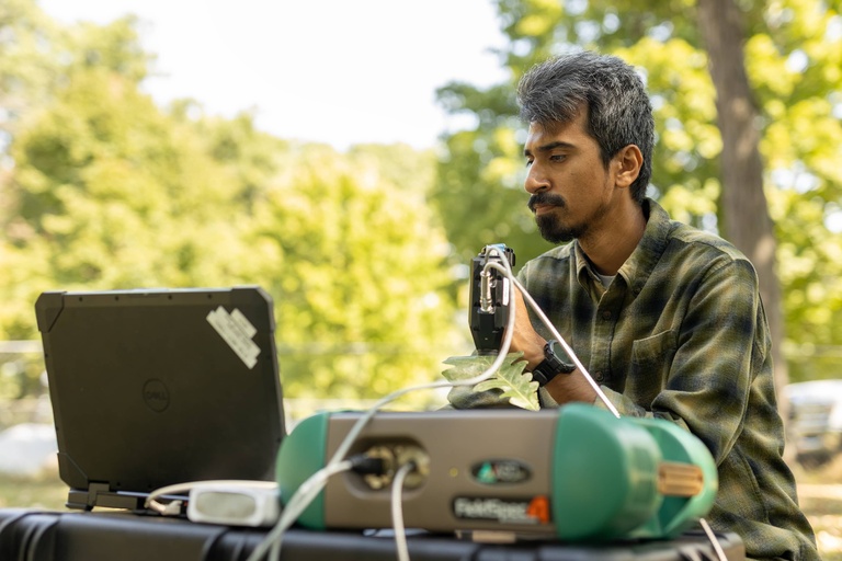 Mainul Islam uses a spectrometer to detect bur oak blight