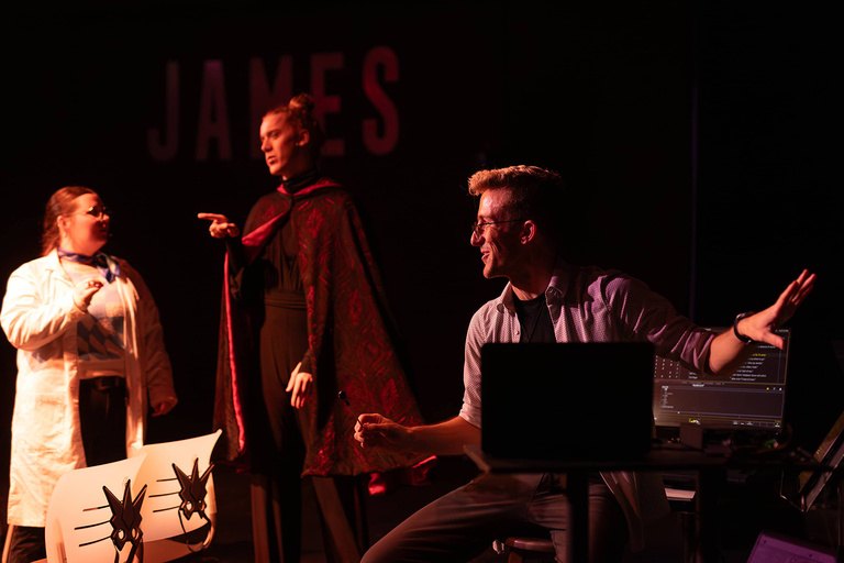 Blake Cordell talking with theater students during rehearsal