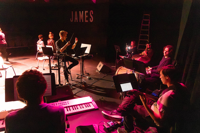Blake Cordell conducting his jazz ensemble at The James