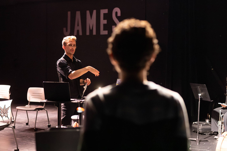 Blake Cordell talking with members of his jazz ensemble