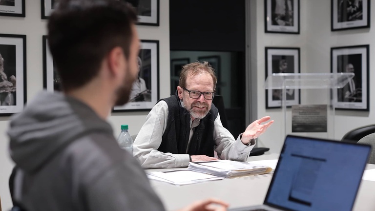 Christopher Merrill teaching a seminar in the Nonfiction Writing Program 11-25