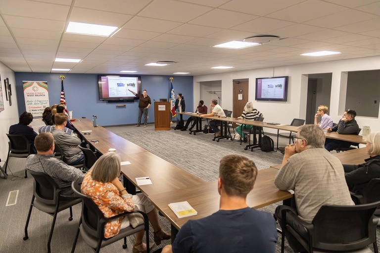 Students present their capstone project to the West Branch community