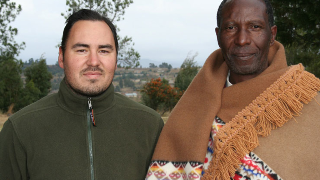 David Riep poses for a photo with a member South Sotho villager in Lesotho