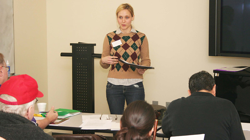 Jennifer Percy presents in front of a room of people