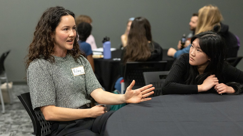 Graduate student discuss academics with another student